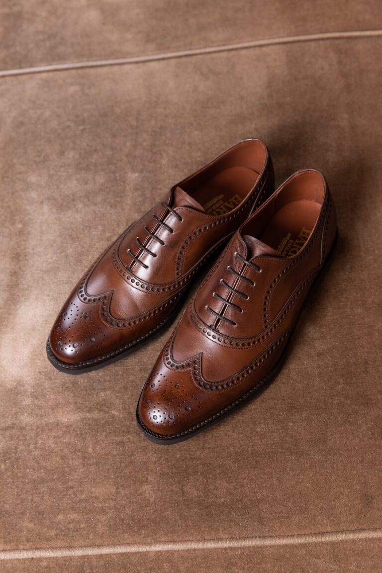 a close up shot of a pair of brogue shoes